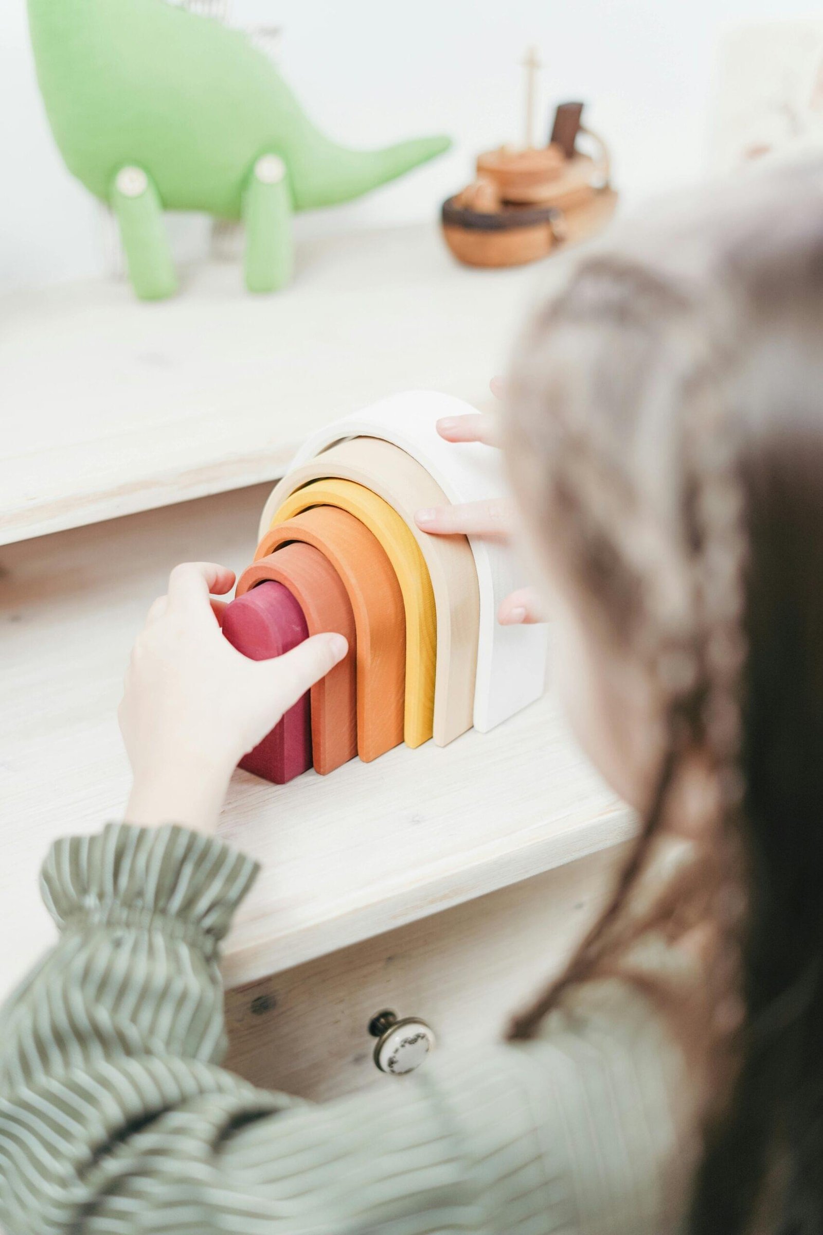 Child playing with colorful building blocks